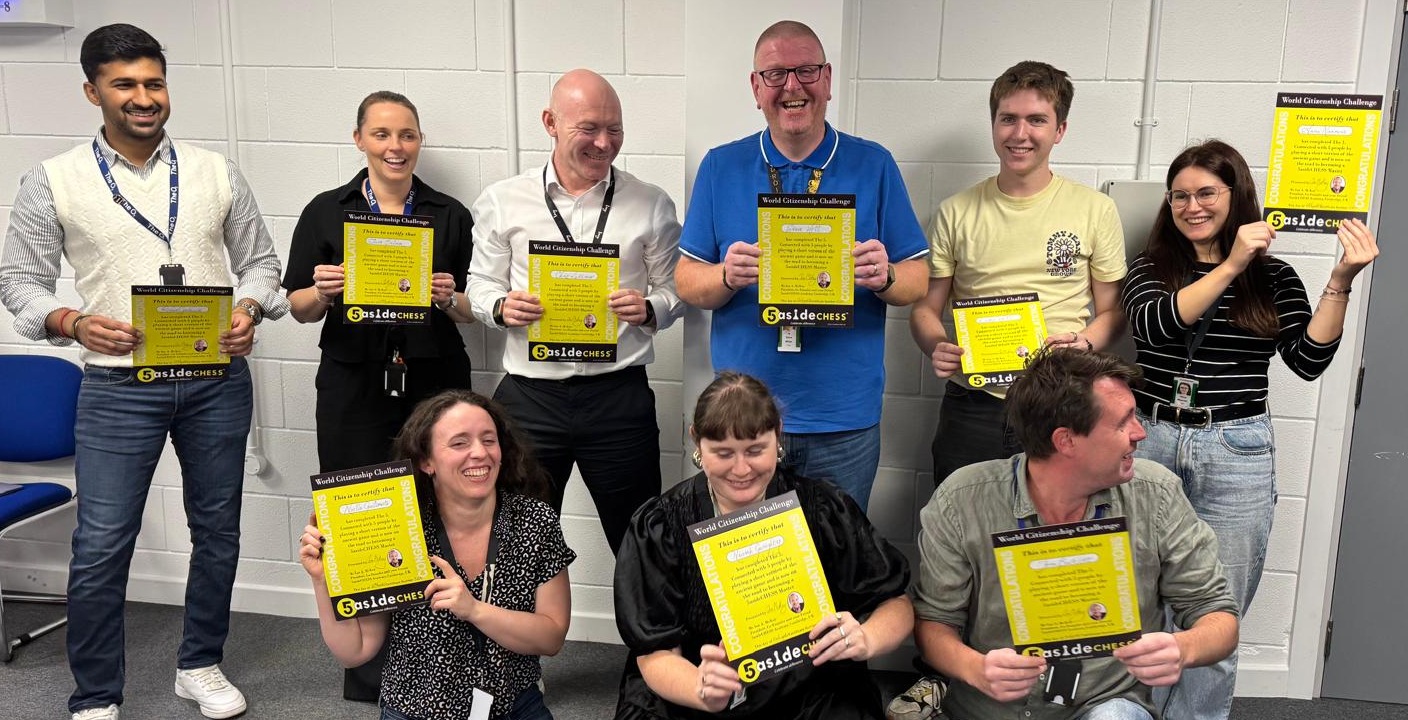 A group of 5asideCHESS players holding their certificates