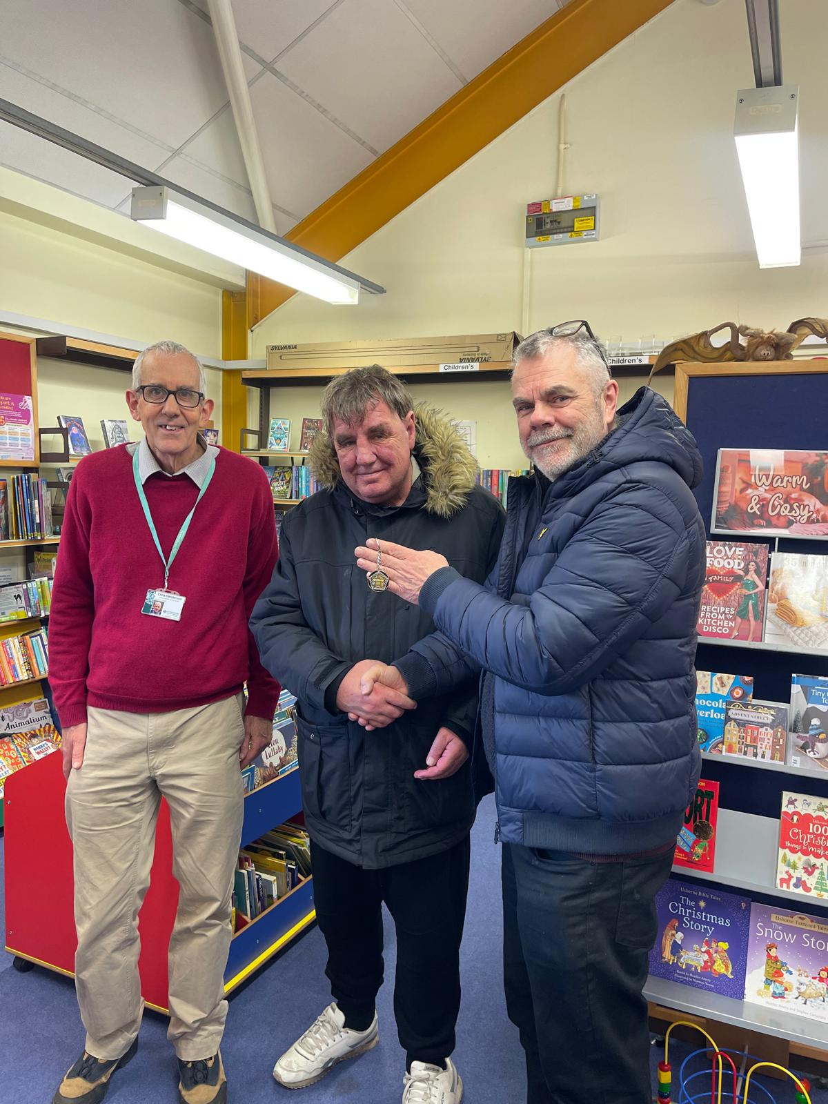 Paul receiving his personalised 5asideCHESS medal at a library in Oxford