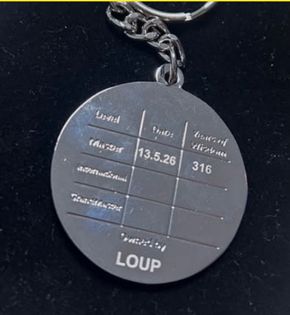 The back of the 5asideCHESS medal, engraved with level, date and years of wisdom